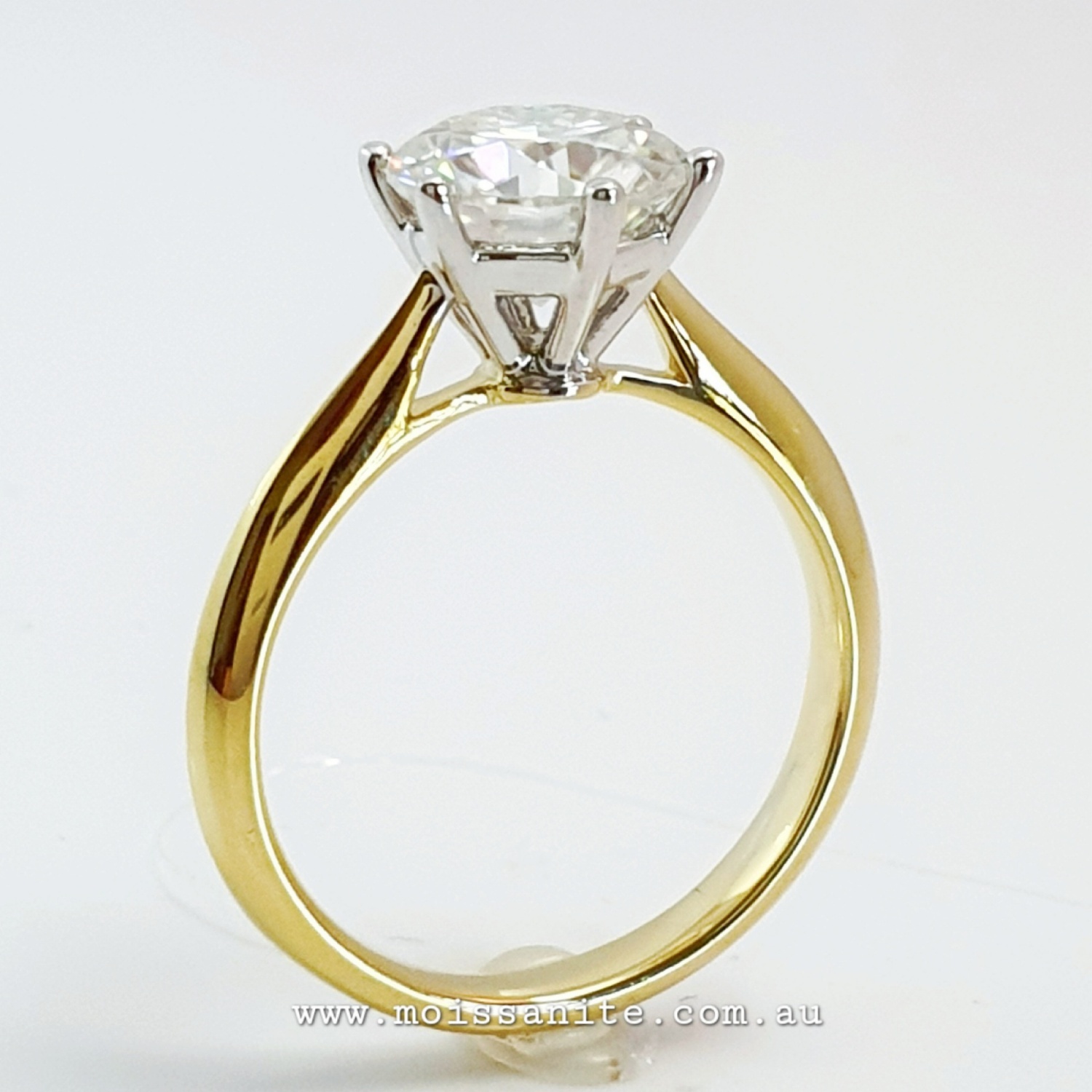 Round Cut Moissanite by Charles & Colvard Cathedral Solitaire